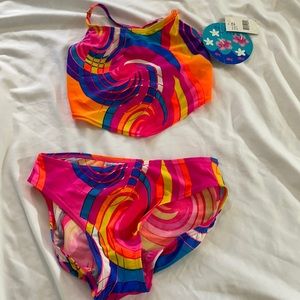NWT girl swimsuit. Top size 12/bottoms size 14